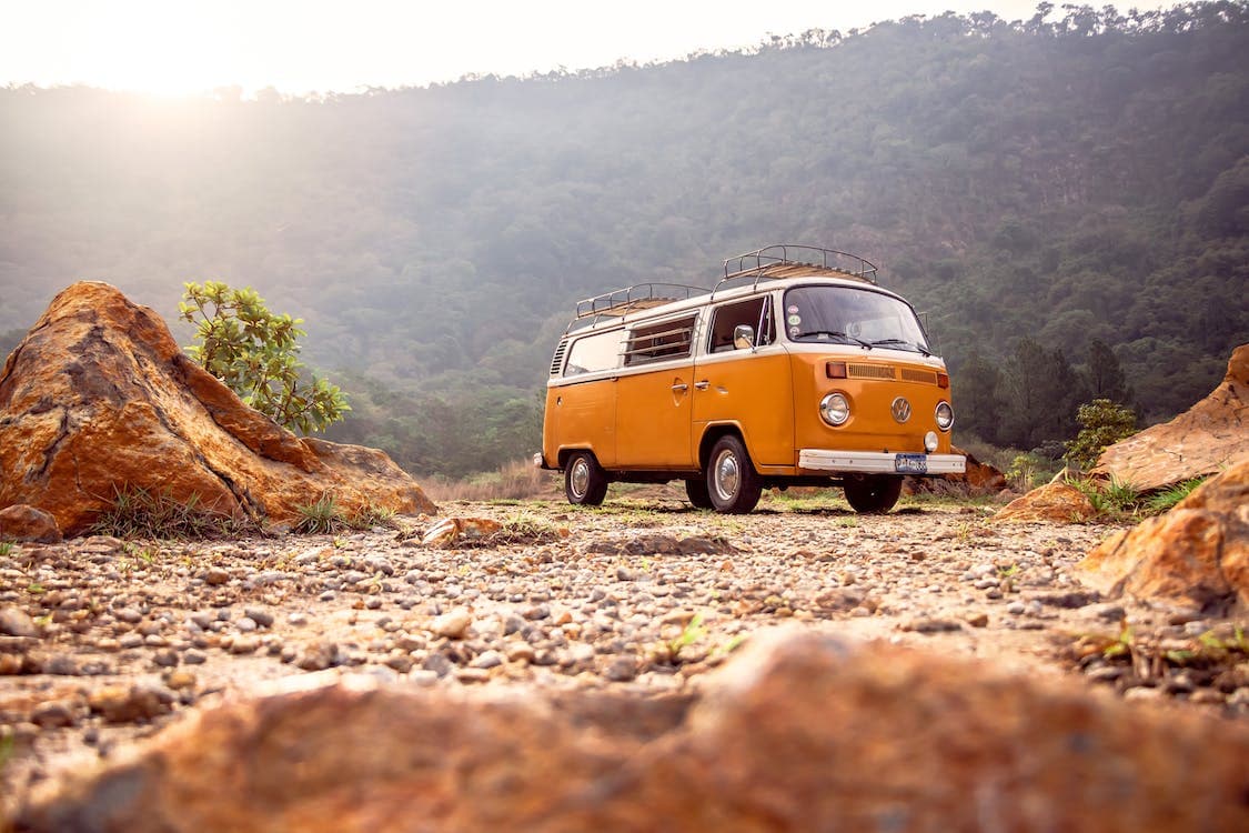 A van is placed in the scenary mountain view