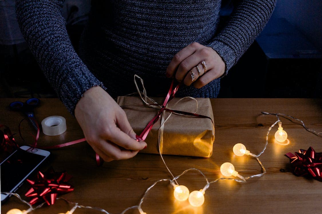 A person wrapping a gift